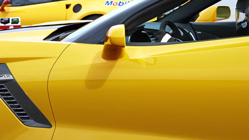 A striking yellow sports car, specifically a Chevy Corvette Z06